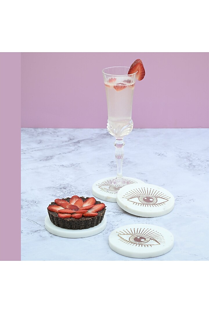 White Marble & Metal Evil Eye Round Coasters ( Set Of 4 ) by Serein Wellness at Pernia's Pop Up Shop