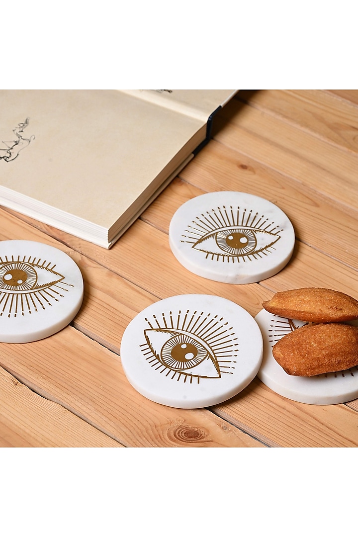 White Marble & Metal Evil Eye Round Coasters ( Set Of 4 ) by Serein Wellness at Pernia's Pop Up Shop