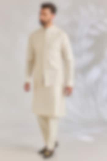 Champagne Raw Silk Floral Embroidered Bundi Jacket Set by Seema Gujral Men at Pernia's Pop Up Shop