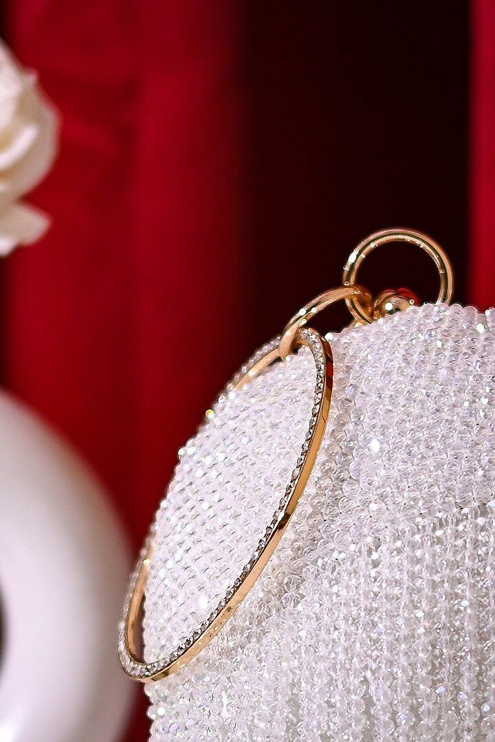 White Raw Silk Crystal Embroidered Round Clutch by Sugarcrush at Pernia's Pop Up Shop