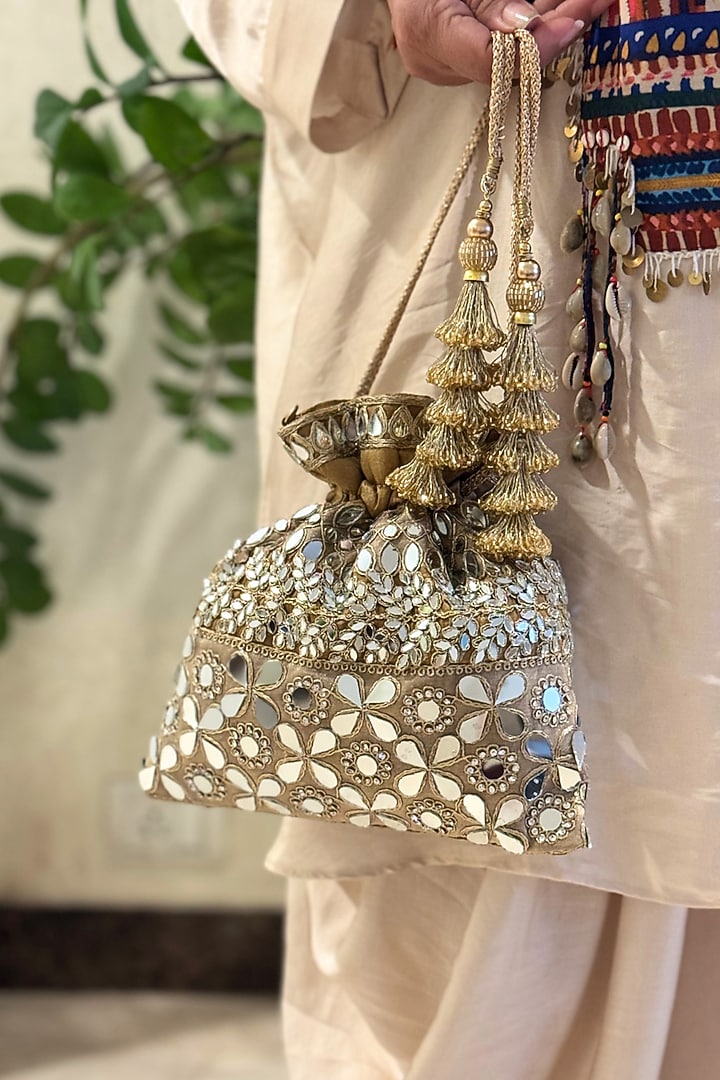 Gold Raw Silk Mirror Work Potli by SG BY SONIA GULRAJANI at Pernia's Pop Up Shop