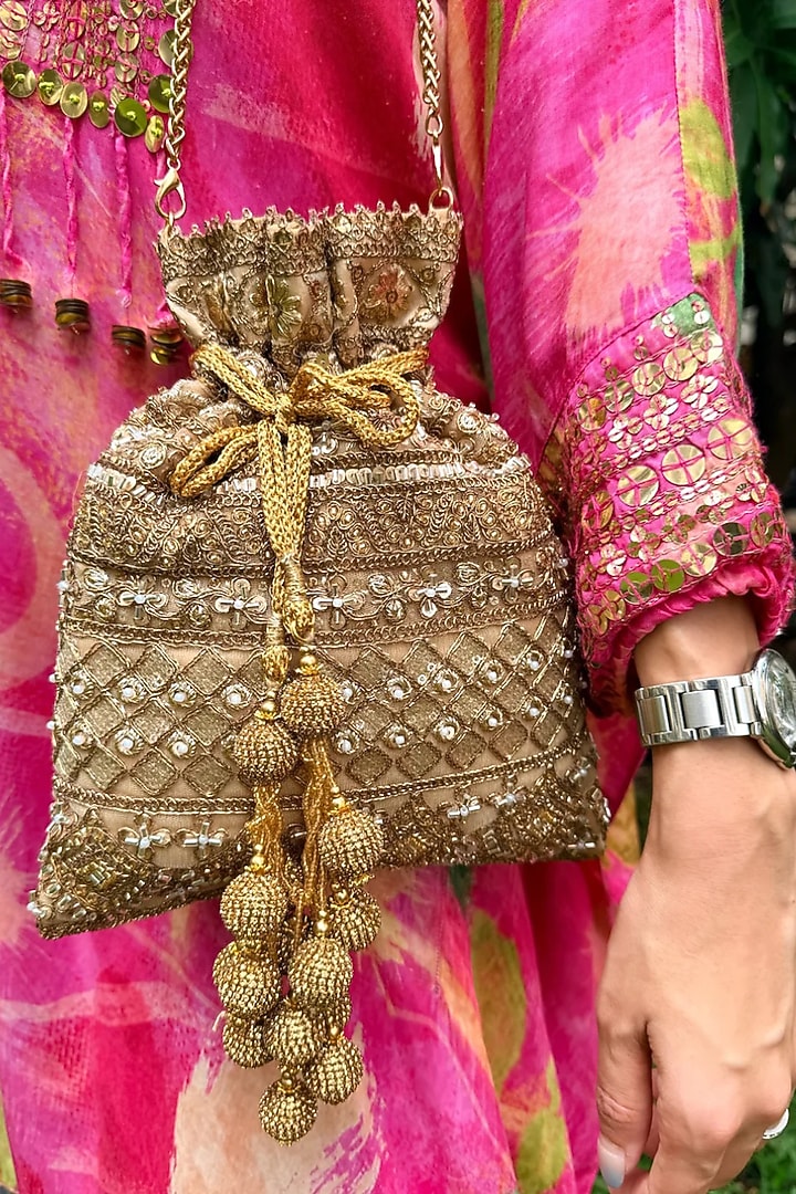 Antique Gold Raw Silk Sequin Embellished Potli Bag by SG BY SONIA GULRAJANI at Pernia's Pop Up Shop