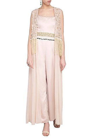 Beige jumpsuit with embroidered cape and belt by Sanya Gulati