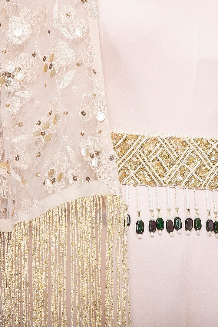 Beige jumpsuit with embroidered cape and belt by Sanya Gulati at Pernia's Pop Up Shop