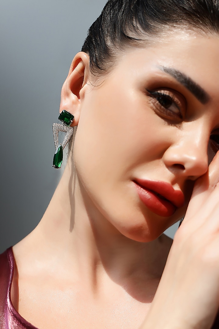 Silver Finish Zircon & Emerald Green Synthetic Stone Dangler Earrings by Shaze Jewellery at Pernia's Pop Up Shop