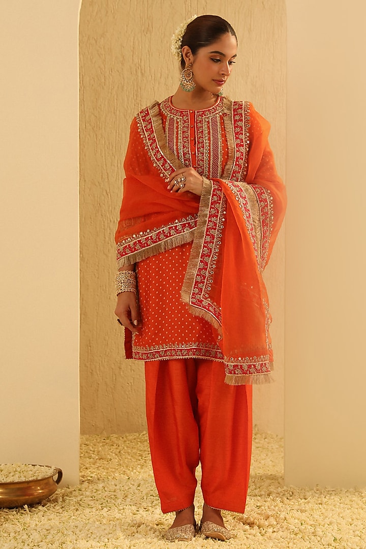 Orange Upada Silk Sequin Embellished Bandhej Short Kurta Set by Sheetal Batra