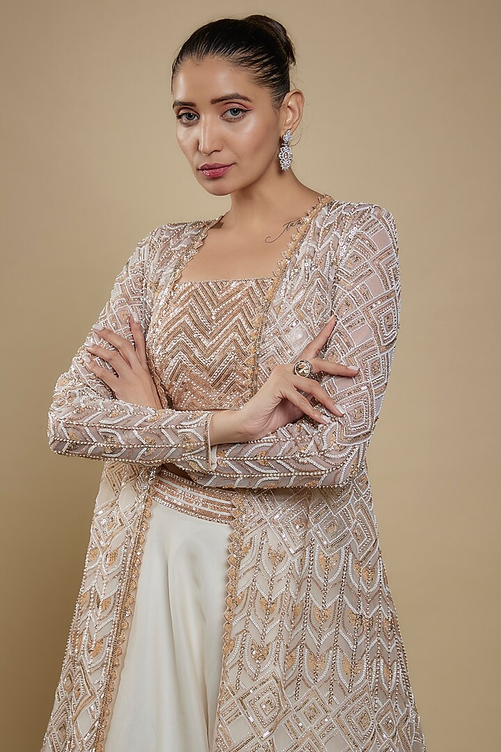 Ivory Net Sequins Embroidered Jacket Wedding Lehenga Set by Shlok Design at Pernia's Pop Up Shop