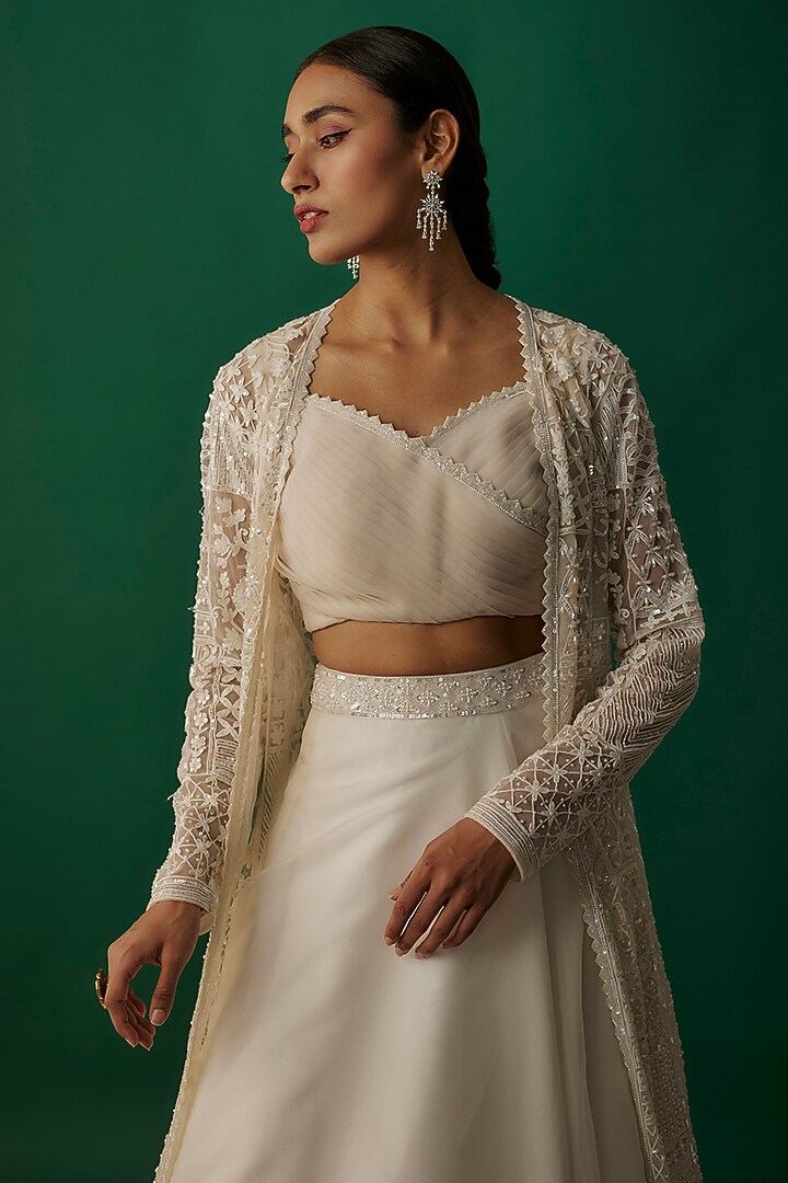 Ivory Net & Organza Sequins Embroidered Jacket Wedding Lehenga Set by Shlok Design at Pernia's Pop Up Shop