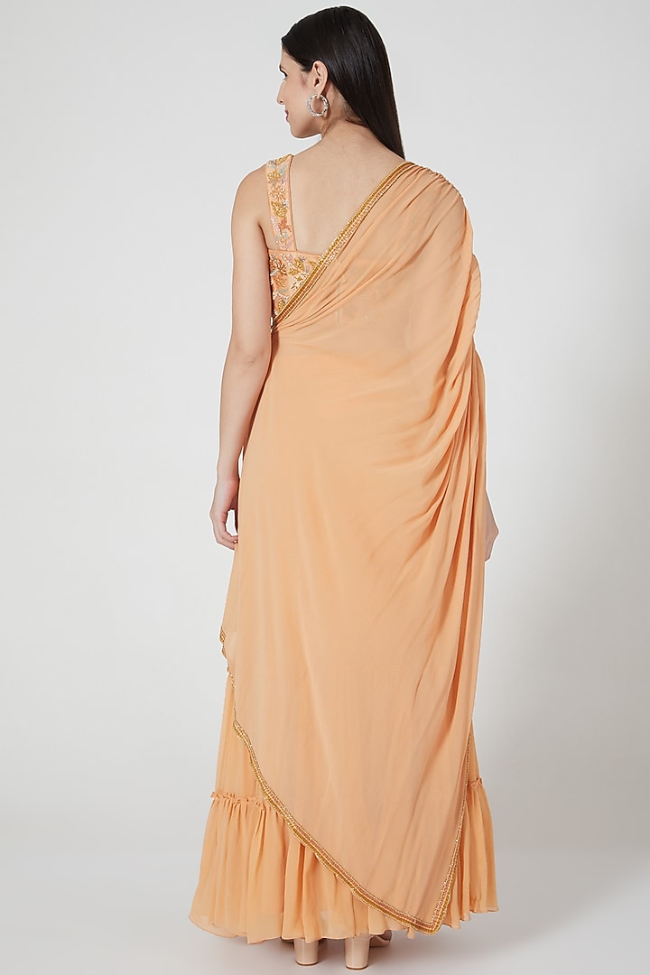 Orange Ruffled Skirt Set With Embroidered Blouse by Shivangi Jain at Pernia's Pop Up Shop