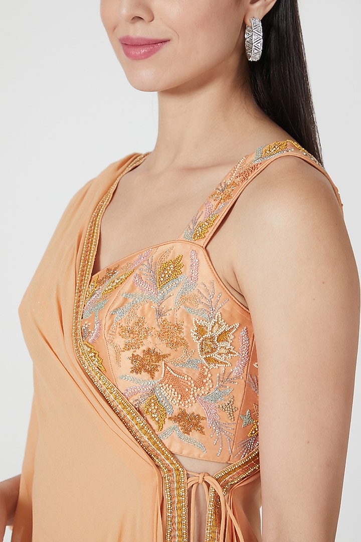 Orange Ruffled Skirt Set With Embroidered Blouse by Shivangi Jain at Pernia's Pop Up Shop