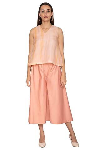 Peach Cotton Satin Flared Pants by Shiori