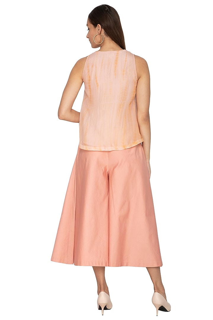 Peach Cotton Satin Flared Pants by Shiori at Pernia's Pop Up Shop