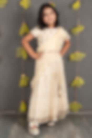Champagne Gold Net Embroidered Lehenga Set For Girls by SHRUTI JALAN at Pernia's Pop Up Shop