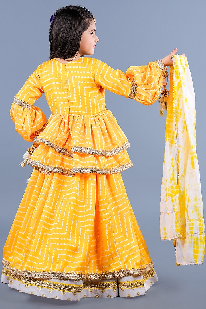 Yellow Cotton & Poly Printed Lehenga Set For Girls by Shining Kanika at Pernia's Pop Up Shop