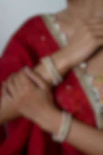 Gold Plated White Jadau Kundan Polki Bangles (Set Of 2) by Shlok Jewels at Pernia's Pop Up Shop
