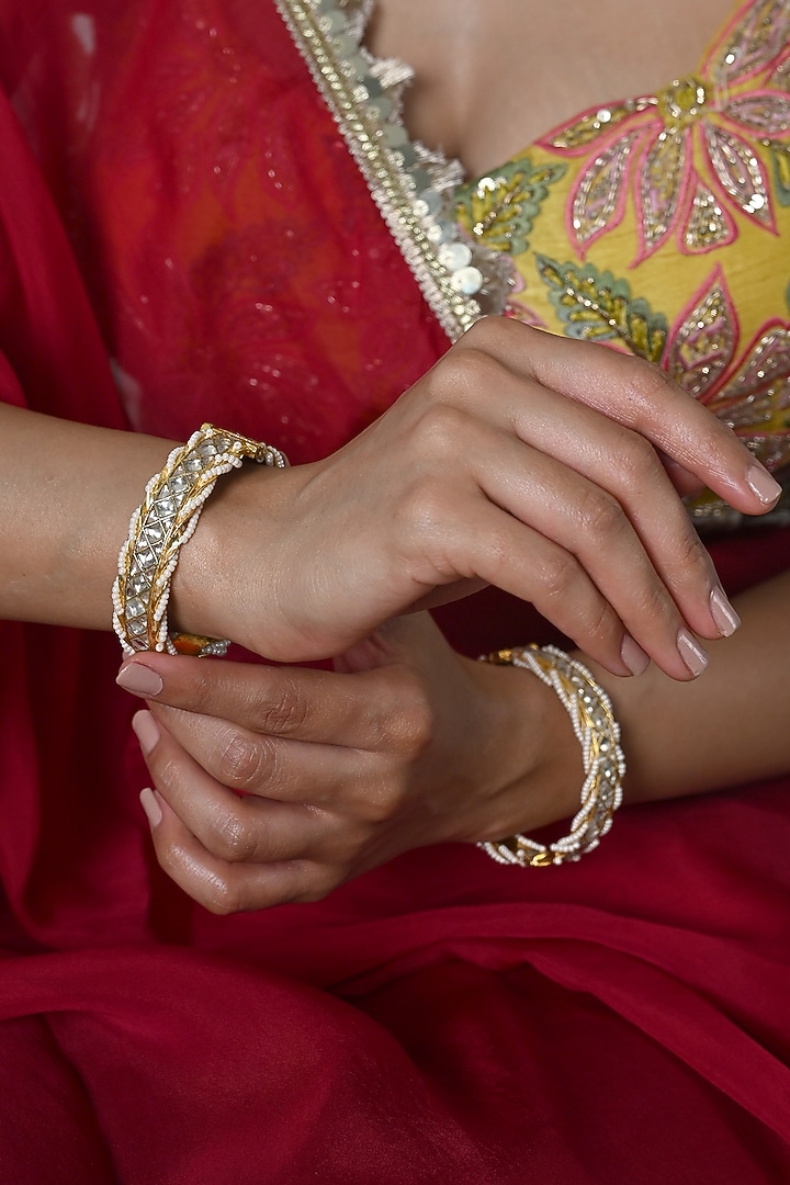 Gold Plated White Jadau Kundan Polki Bangles (Set Of 2) by Shlok Jewels at Pernia's Pop Up Shop