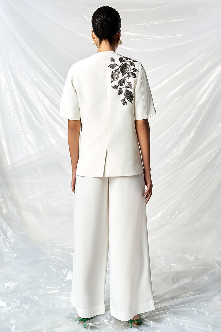 Ivory Satin Crepe Flared Pants by Shahin Mannan at Pernia's Pop Up Shop