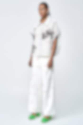 Ivory Double Crepe Flared Pants by Shahin Mannan at Pernia's Pop Up Shop