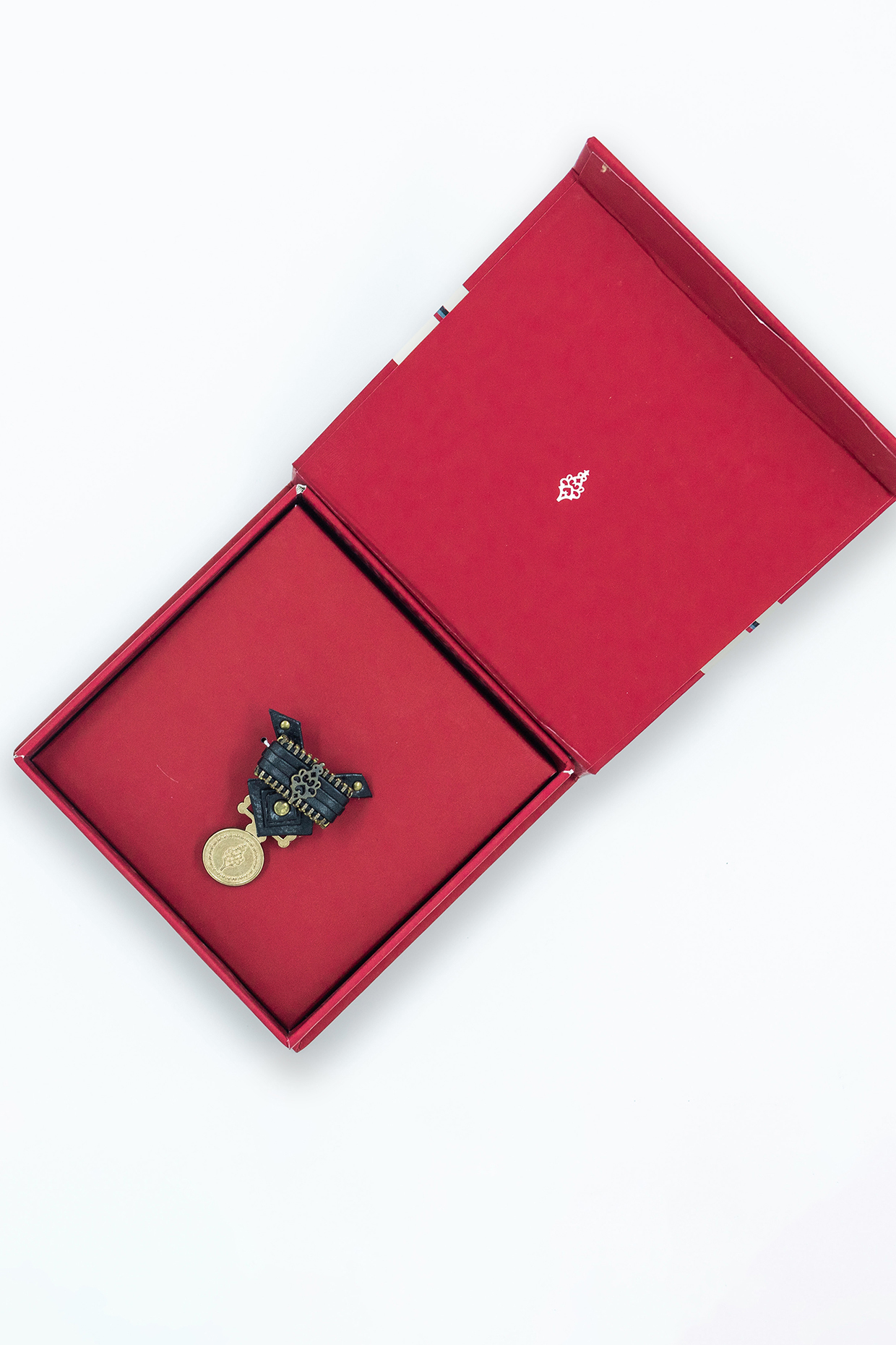 Black Faux Leather & Metal Crest Brooch by S&N by Shantnu Nikhil Men