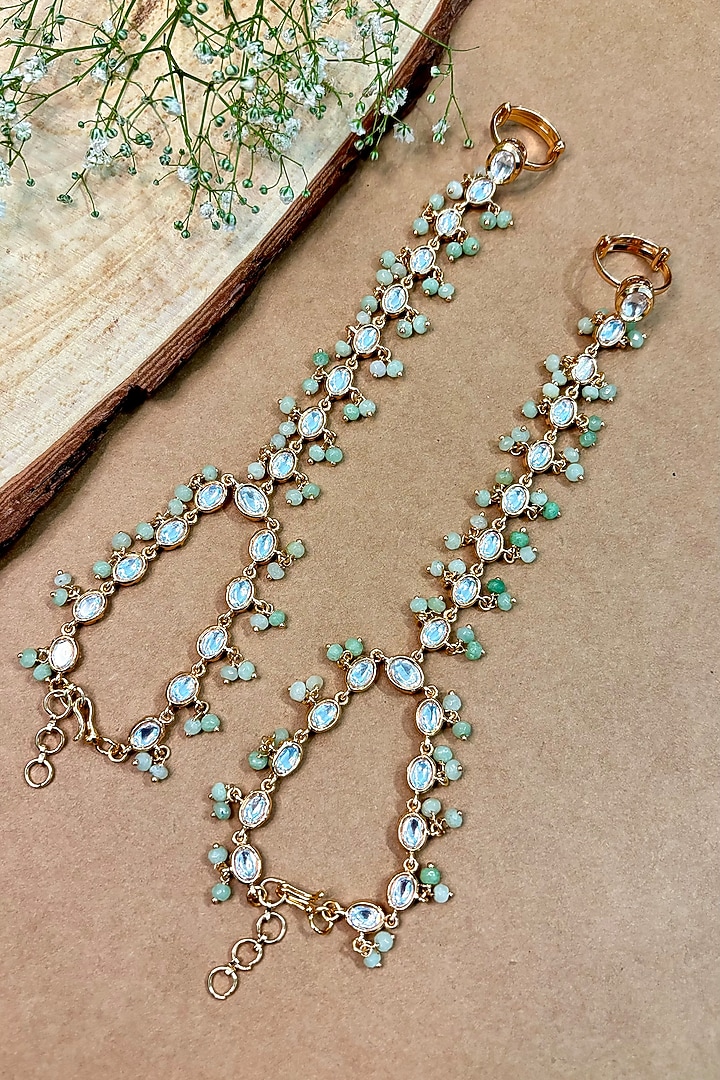 Gold Finish Kundan Polki & Green Beaded Handcrafted Enameled Hathphool (Set Of 2) by Shop Naymee at Pernia's Pop Up Shop