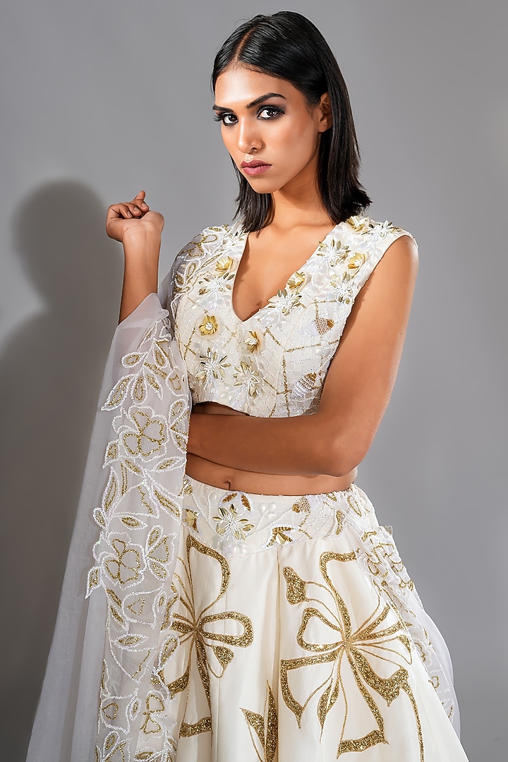 Off-White Silk Golden Sequins Embroidered Wedding Lehenga Set by Shruti S at Pernia's Pop Up Shop