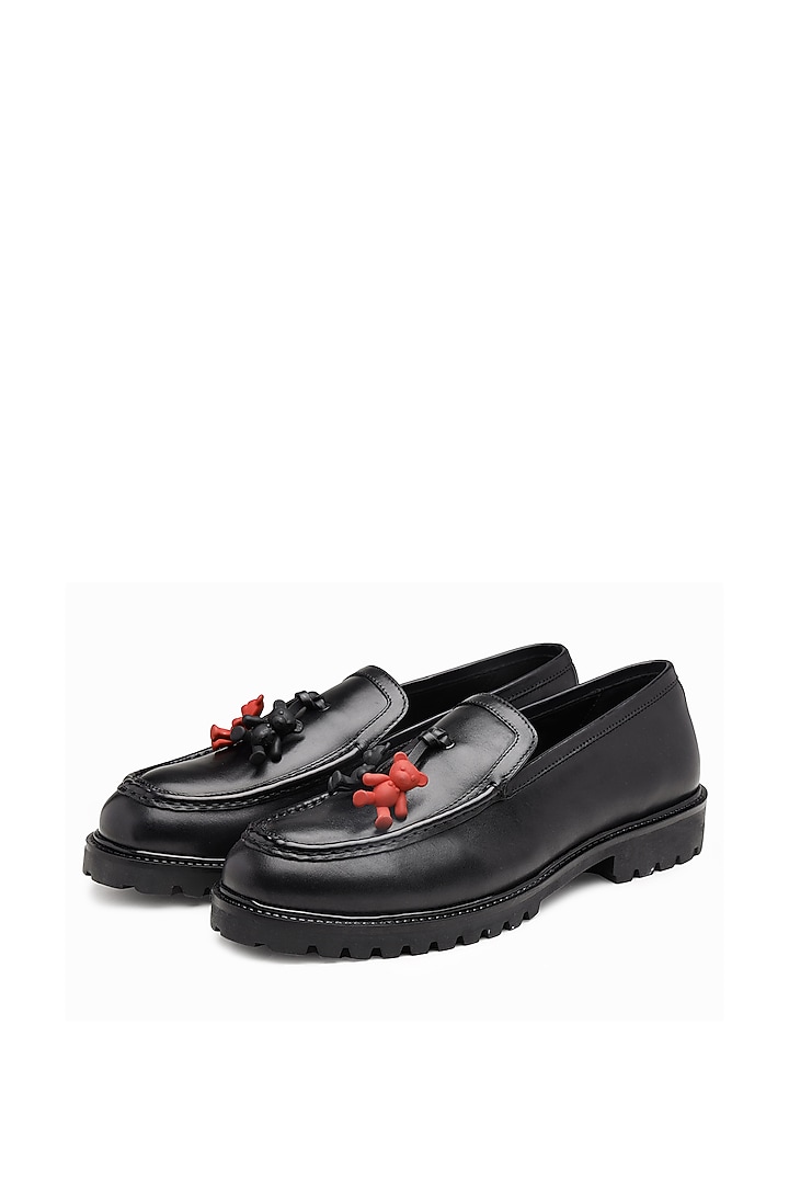 Black Leather Embellished Slip Ons by SHUTIQ at Pernia's Pop Up Shop
