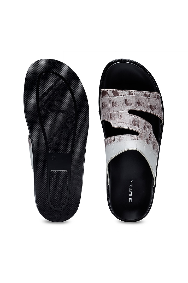 Black Leather Slip-Ons by SHUTIQ at Pernia's Pop Up Shop