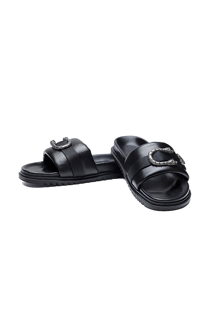 Black Leather Criss-Cross Strap Slip-Ons by SHUTIQ at Pernia's Pop Up Shop