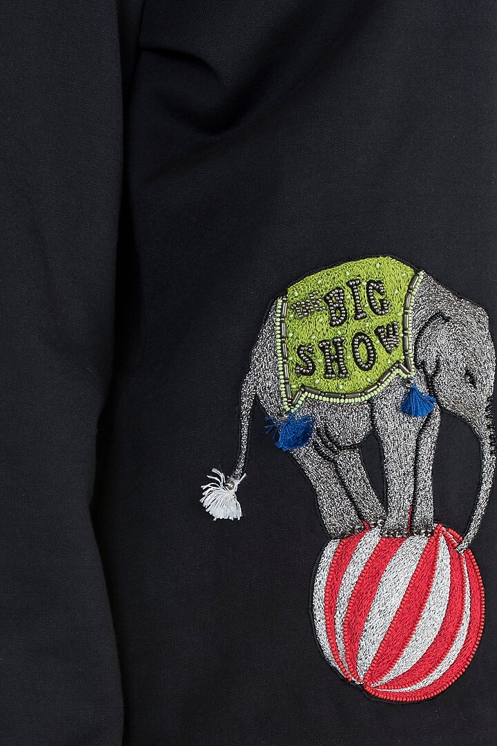 Black embroidered sweatshirt available only at Pernia's Pop Up Shop.