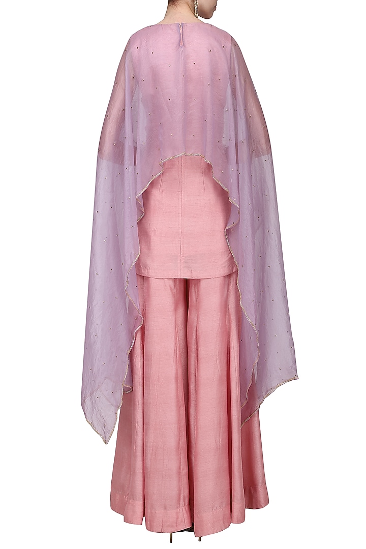 Lavender asymmetrical embroidered cape with pink top and flare pants available only at Pernia's Pop Up Shop.