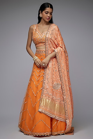 Orange Net & Silk Crushed Overlay Lehenga Set by Siddhartha Daga