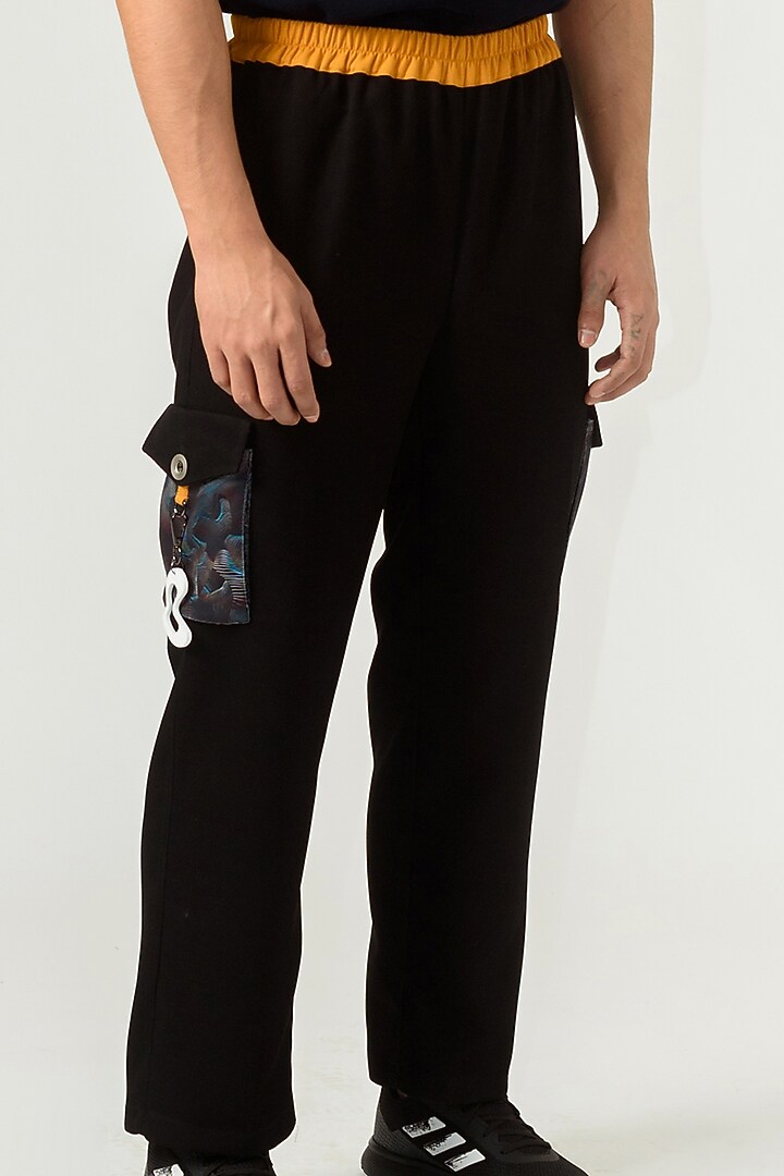 Black Poly Knit Textured Crepe Trousers by Siddhant Agrawal Men at Pernia's Pop Up Shop