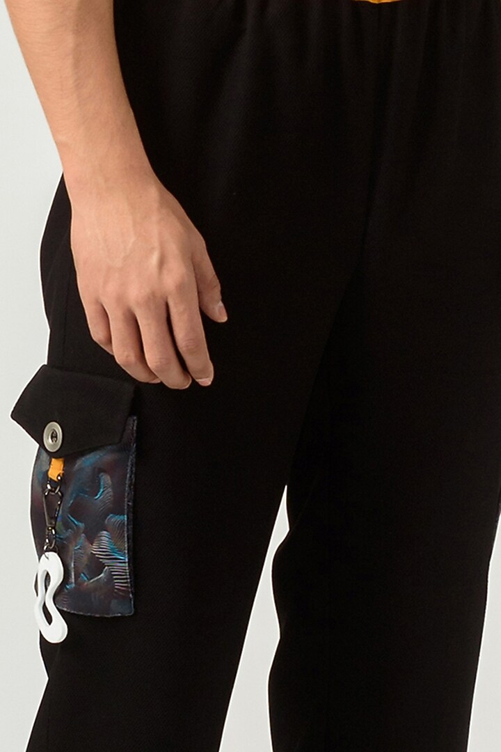 Black Poly Knit Textured Crepe Trousers by Siddhant Agrawal Men at Pernia's Pop Up Shop