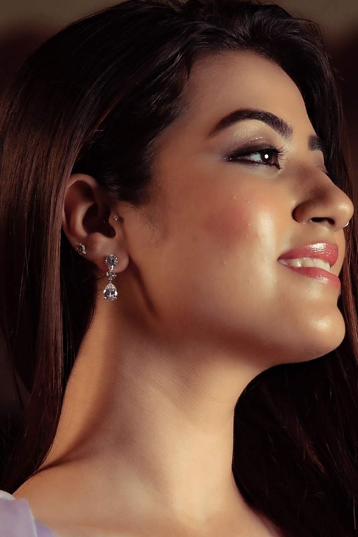 White Finish Zircon Dangler Earrings In Sterling Silver by Silver Ishq at Pernia's Pop Up Shop
