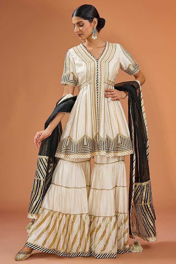 White Muslin Gota Embellished Tiered Sharara Set by Simar Dugal at Pernia's Pop Up Shop