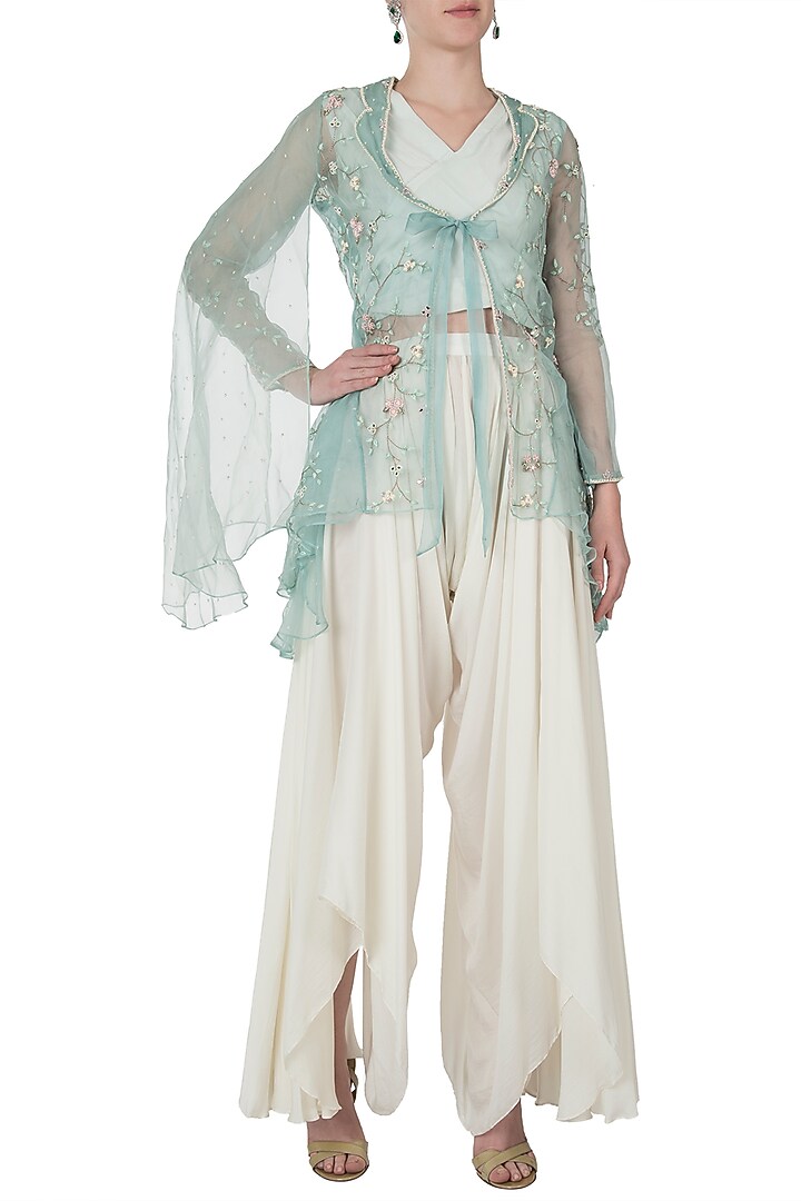 Emerald embellished jacket with ivory top and drape pants by Shreya Jalan Mehta at Pernia's Pop Up Shop