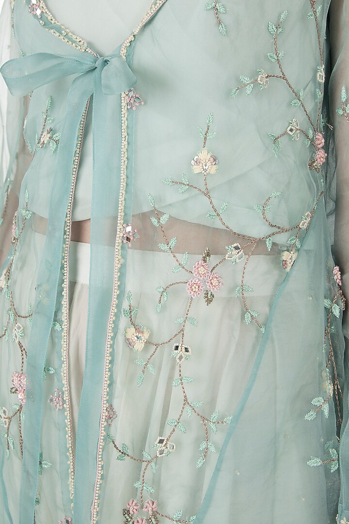 Emerald embellished jacket with ivory top and drape pants by Shreya Jalan Mehta at Pernia's Pop Up Shop