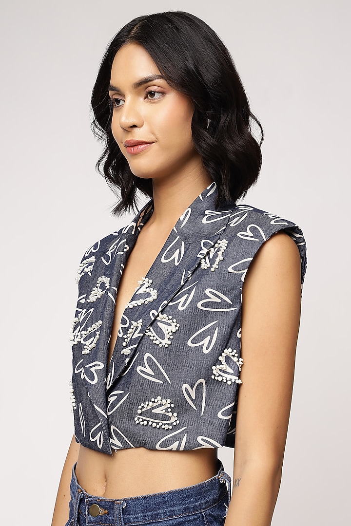 Blue Tencel Denim Heart Printed Sleeveless Jacket by Sakshi Khetterpal at Pernia's Pop Up Shop