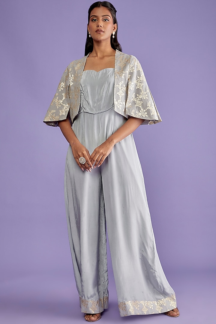 Grey Crepe Flared Jumpsuit With Cape by Sk'n