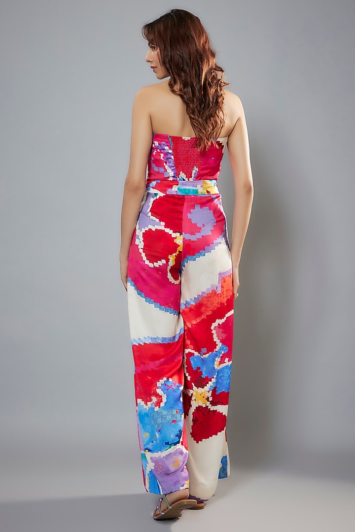 Red Satin & Chiffon Ikat Printed Halter Neck Jumpsuit With Belt by Saaksha & Kinni at Pernia's Pop Up Shop