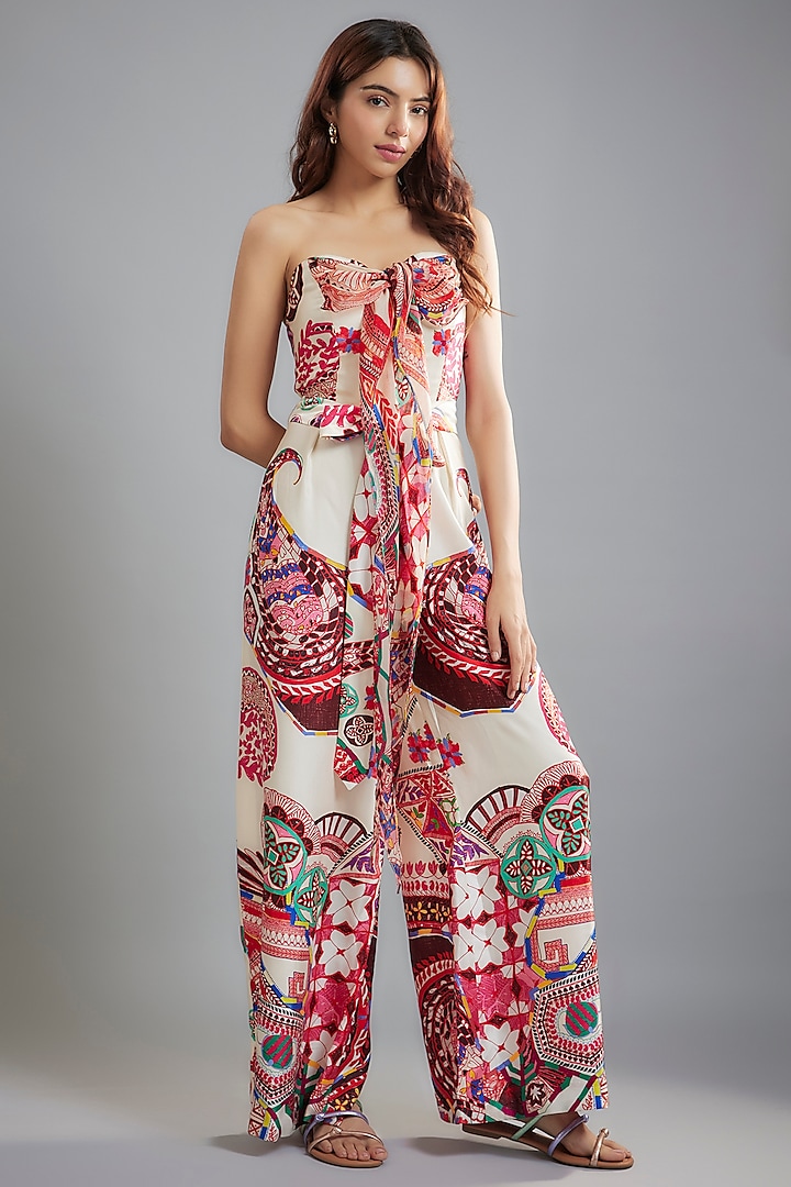 Ivory Satin & Chiffon Ikat Printed Halter Neck Jumpsuit With Belt by Saaksha & Kinni at Pernia's Pop Up Shop