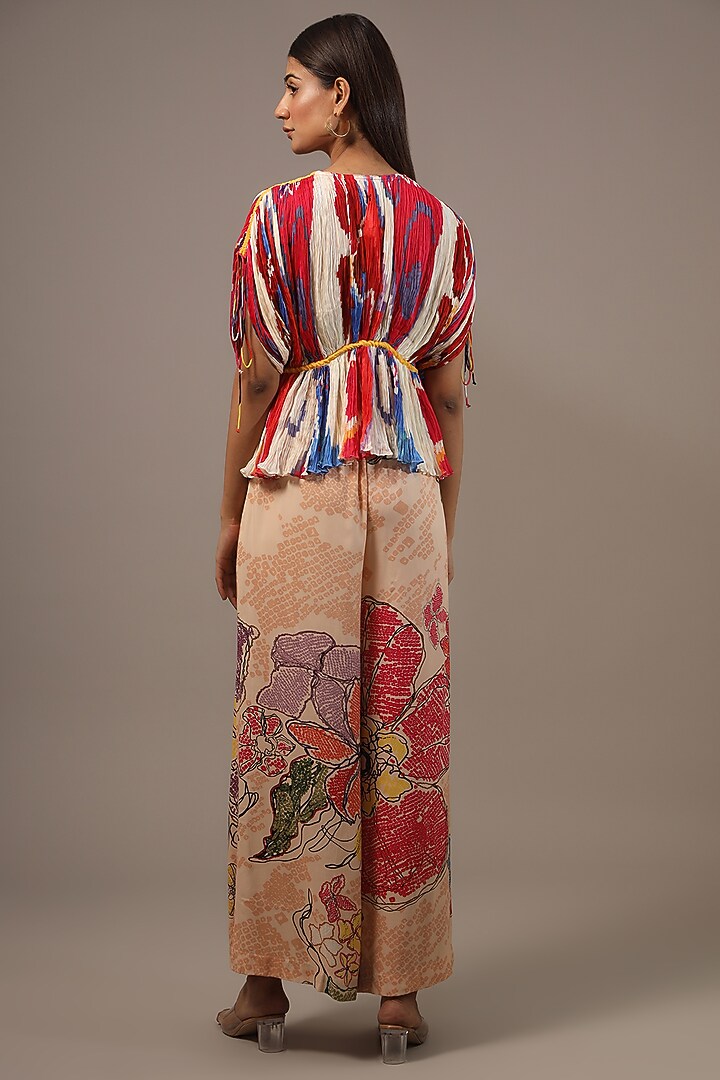 Peach Satin Bandhani Printed Palazzo Pants by Saaksha & Kinni at Pernia's Pop Up Shop