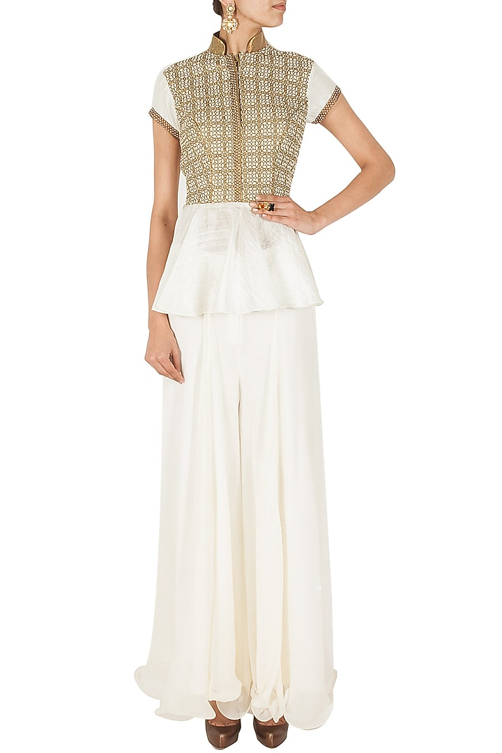 Ivory and gold peplum sharara set available only at Pernia's Pop-Up Shop.