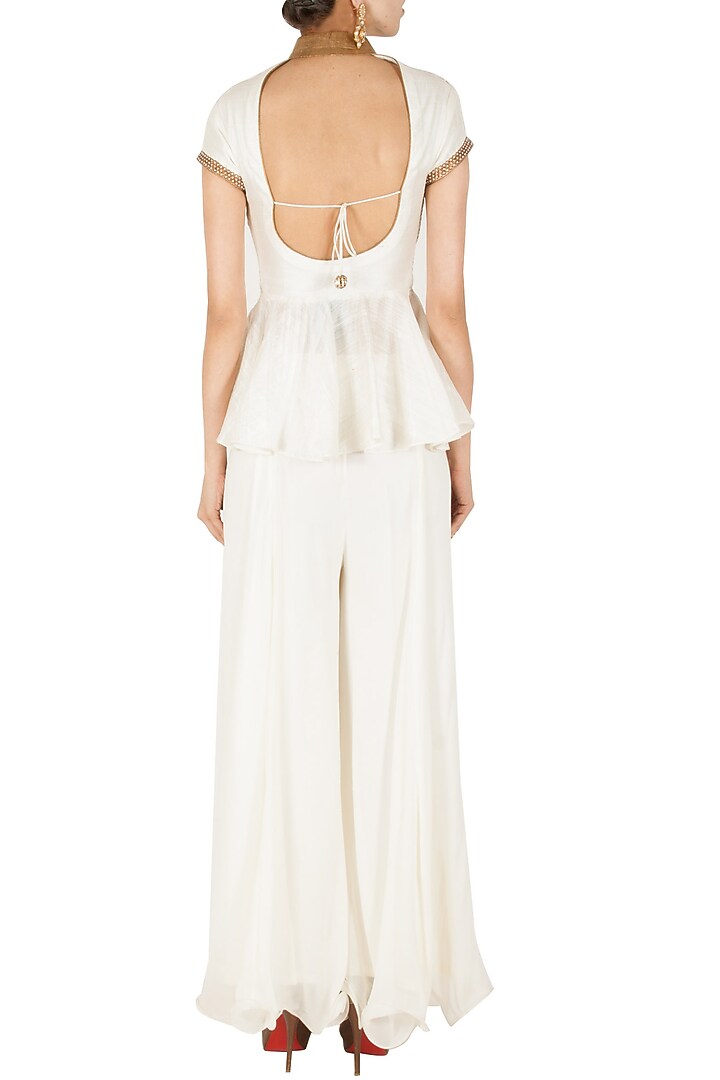 Ivory and gold peplum sharara set available only at Pernia's Pop-Up Shop.