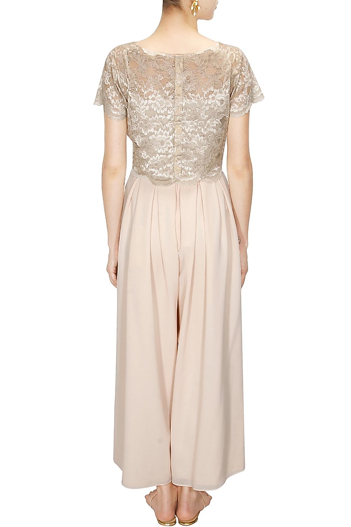 Blush pink pleated flared pants available only at Pernia's Pop-Up Shop.