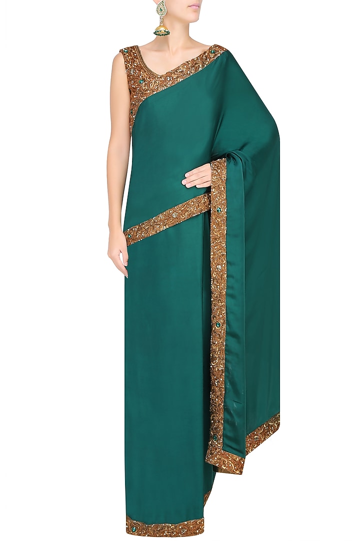 Bottle green nakshi embroidered saree with antique gold blouse available only at Pernia's Pop Up Shop.