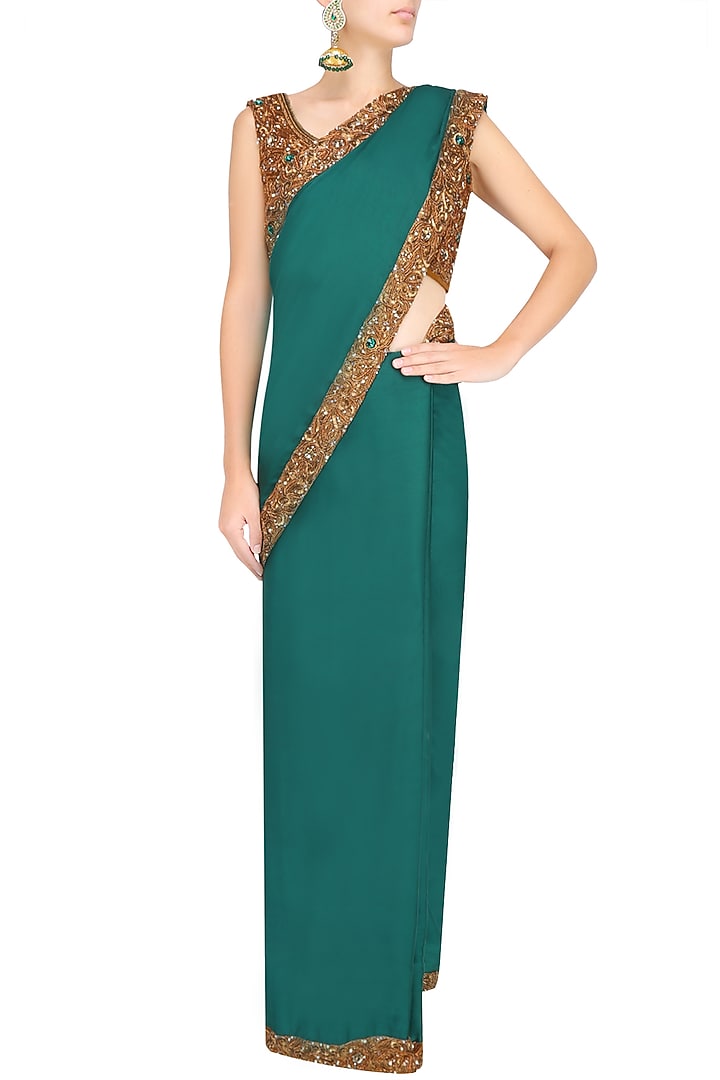 Bottle green nakshi embroidered saree with antique gold blouse available only at Pernia's Pop Up Shop.