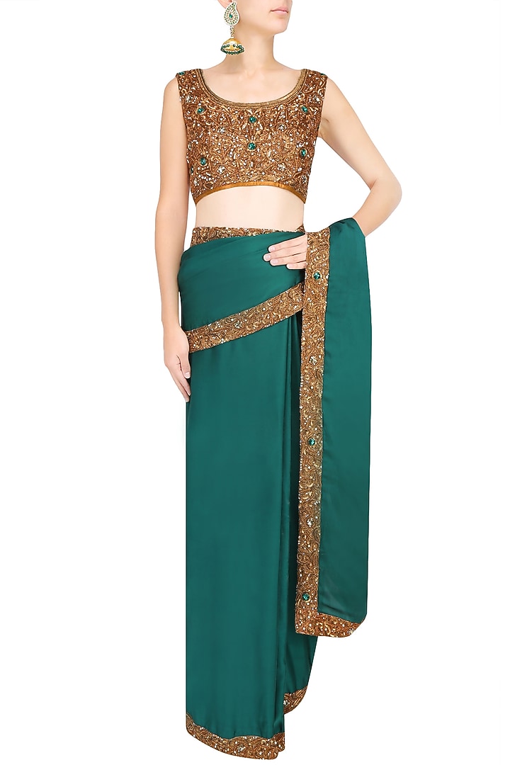 Bottle green nakshi embroidered saree with antique gold blouse available only at Pernia's Pop Up Shop.