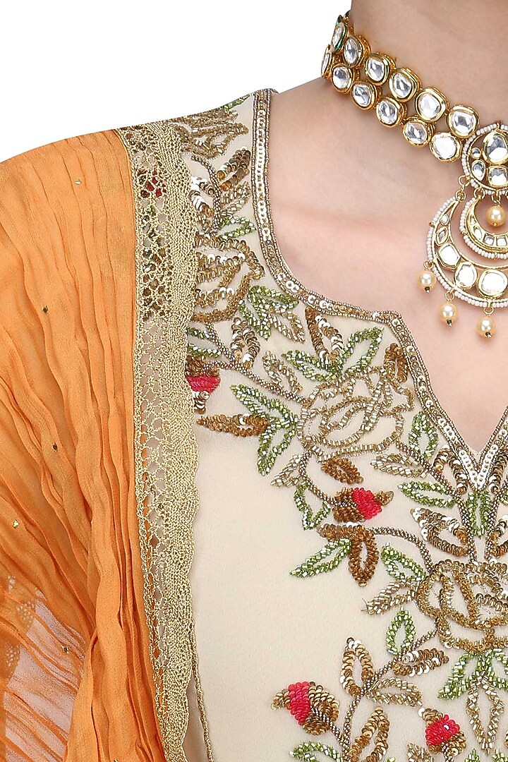 Beige floral embroidered kalidaar kurta set with orange dupatta available only at Pernia's Pop Up Shop.
