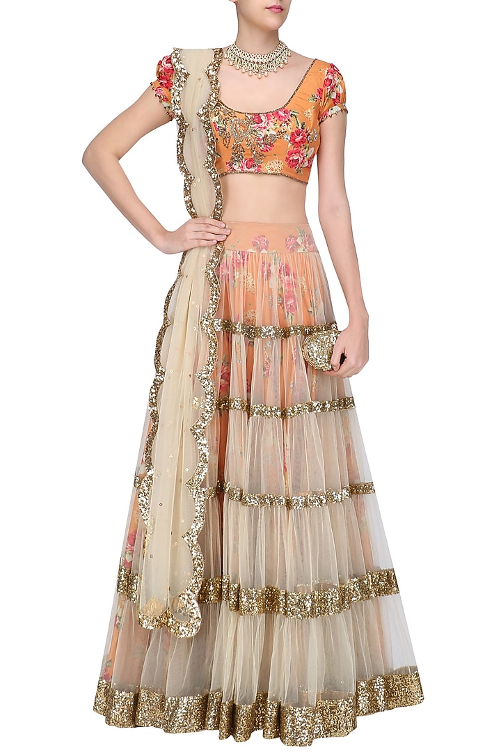 Beige lehenga skirt and orange floral embroidered blouse set available only at Pernia's Pop Up Shop.